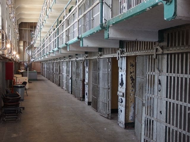 Photo of a prison cell representing where inmates can be victims of identity theft while incarcerated and how Schlanger Law Group may help