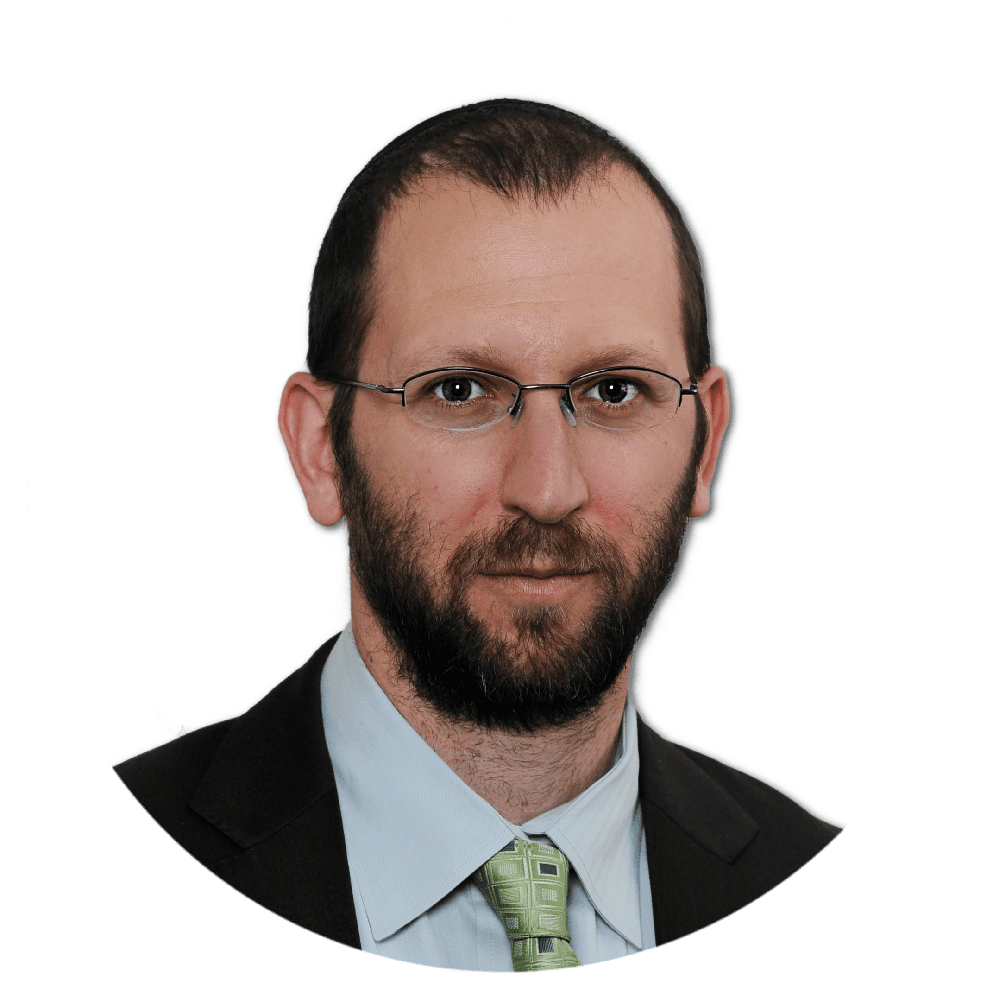 Man in glasses, suit, and tie.